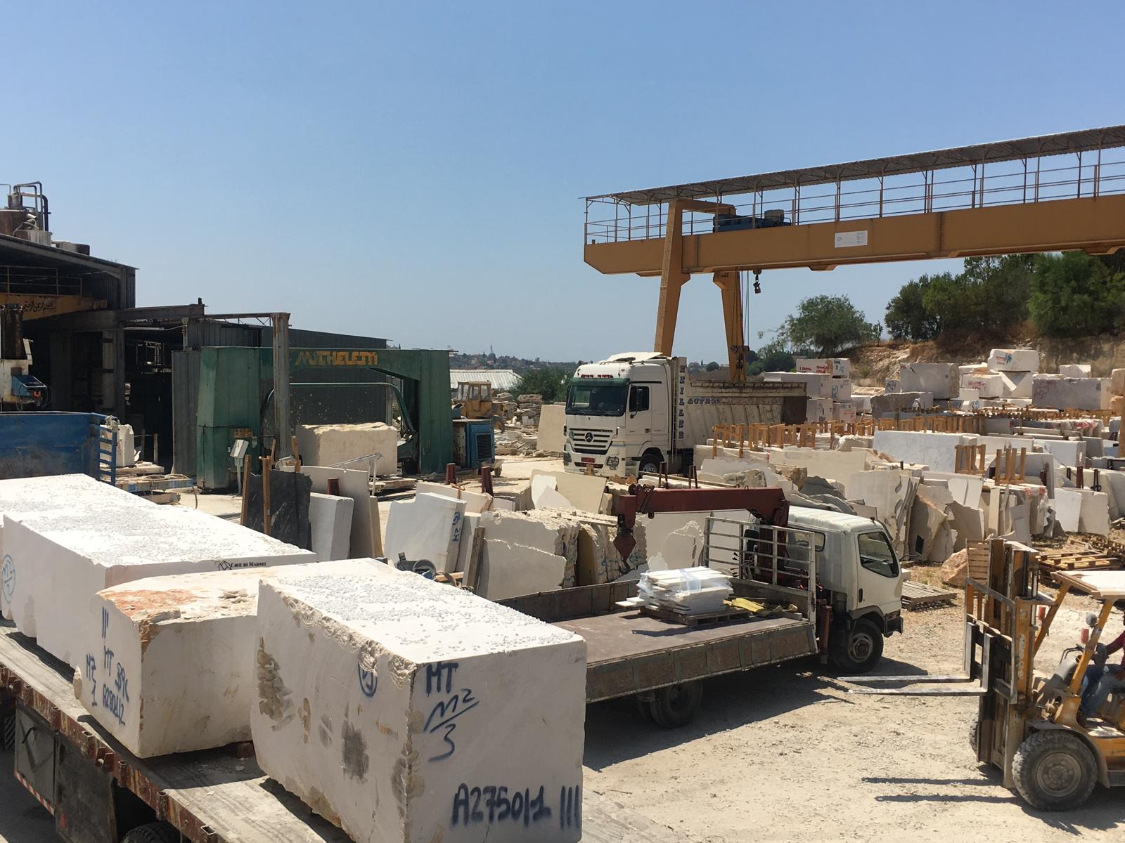 Marble blocks and slabs at the Mazeh Co. stone yard